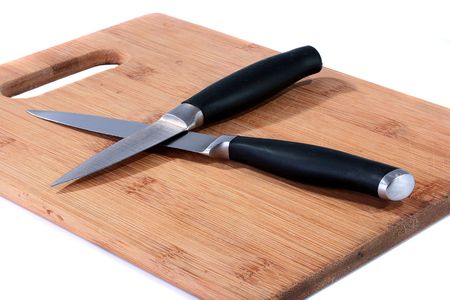 Set from two knifes on bamboo boards for food cutting.の写真素材