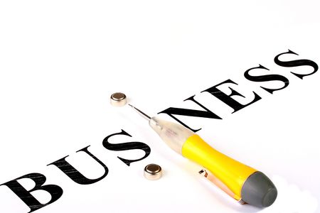 The word Business in which instead of the letter I lies an electric tester and two accumulators.の写真素材