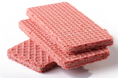 Darkly pink three wafers as a dessert.の写真素材