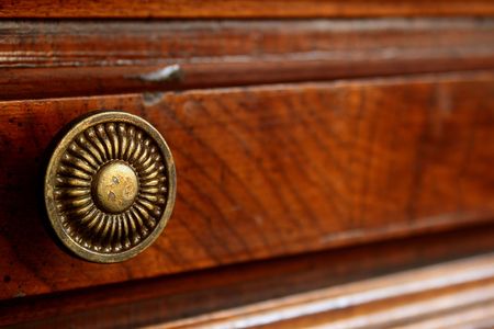 The ancient decorative handle of a box of a wooden desk.の写真素材
