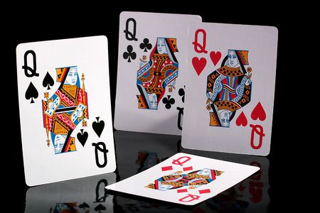 Four ladies from a card pack on a black reflecting background.のeditorial素材