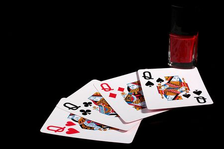 Four playing cards from a pack with the image of ladies and a small bottle of a varnish for manicure. A varnish for women.のeditorial素材