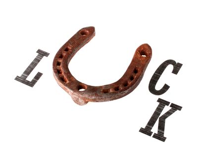 Inscription good luck with replacement of letter U by an old horseshoe.の写真素材