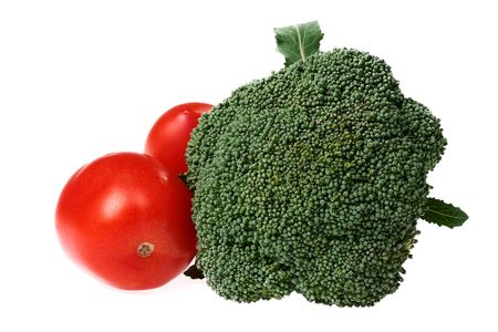 Fresh vegetables on a white background, a broccoli and two tomatoes.の写真素材