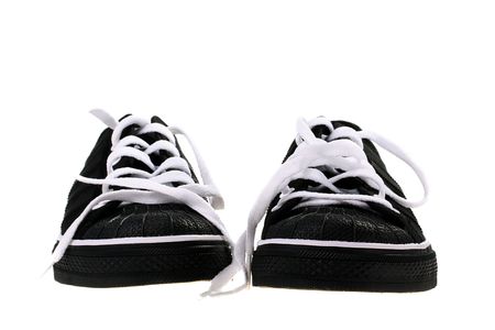Black sports footwear with white laces for employment indoors and on court.の写真素材