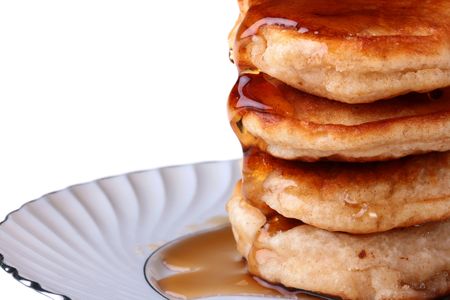 Pancake with honey or with a syrup on a plate.