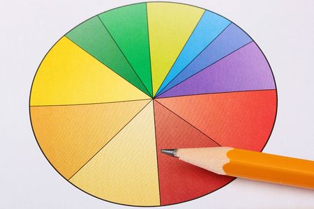 The circular diagramme with colour segments and a pencil.の写真素材