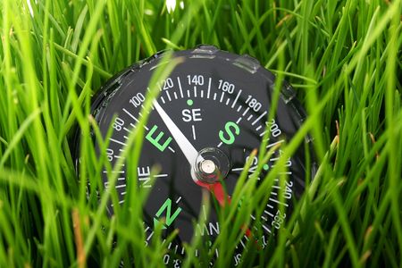 The tool for definition of parts of the world in a high green grass.の写真素材
