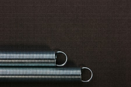 Spiral spring working on a stretching, for various mechanical works.の写真素材