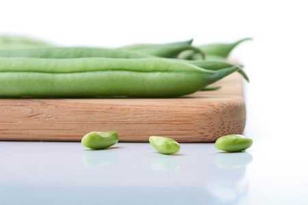 Vegetable kidney bean beans against on a kitchen board.の写真素材