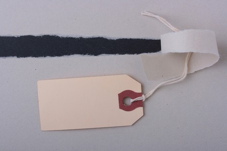 The grey background has rupture and under it there is a black background, on the grey the label...