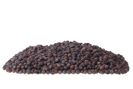 Black pepper not ground on a white background.の写真素材