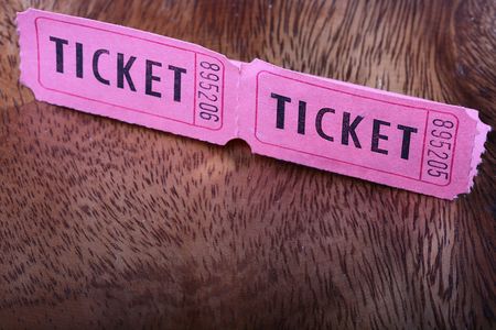 Tickets for a pink cardboard for visiting of show, concerts etc.の写真素材