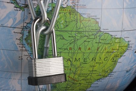 Metal lock and chain on a globe.の写真素材