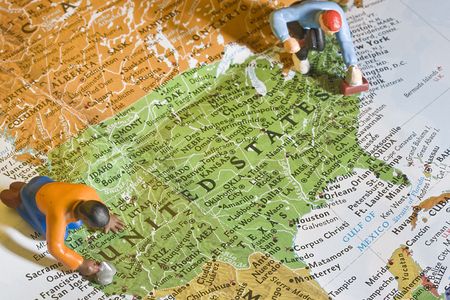 Human figures on a map of United States of America.の写真素材