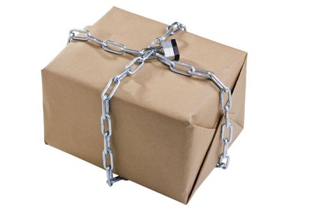 Box wrapped around with a chain and closed with a lock on a white background.の写真素材