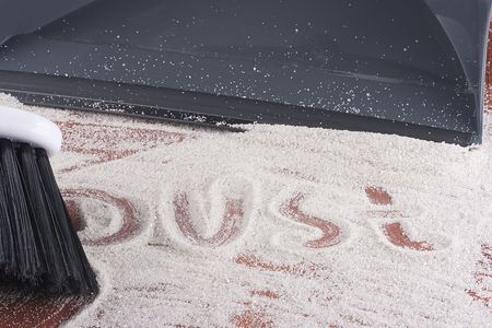 House cleaning, on a floor small sand simulating dust is scattered.の写真素材