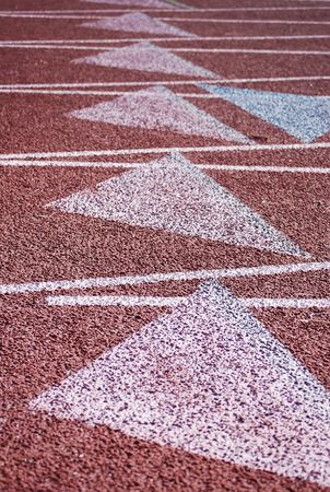 Stadium, a racetrack brown of artificial turf for sports.