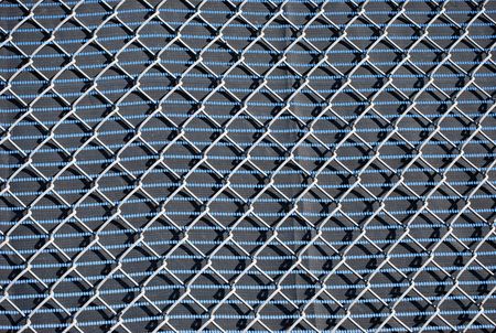 A fence made of mesh netting with a tissue surface to limit the review of passers-by.