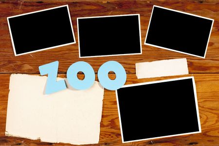Old wooden surface with a clean sheet of paper for creativity on the theme of the zoo.
