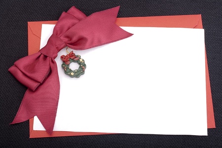 Congratulatory letter with a red envelope and a scarlet ribbon.の写真素材