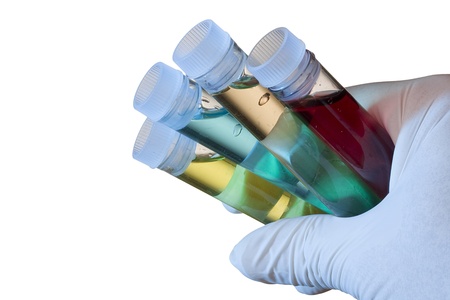 Hand in a glove holding test tubes.