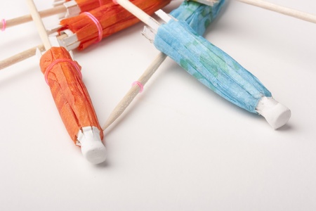 Paper umbrellas to decorate the glasses with a cocktail.の写真素材