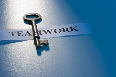 A key laying on a piece of paper with the word 