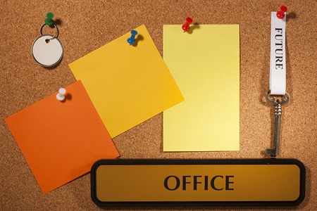 Key with a future tag hanging on a brown board. Add your text to the background.の写真素材