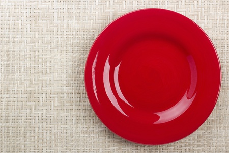 Round ceramic dish on a background mat for the second course.の写真素材