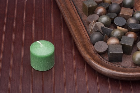 Scented candle and a set of decorative objects made of aromatic wood.の写真素材