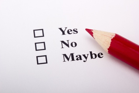 A red pencil laying on an opinion poll.の写真素材