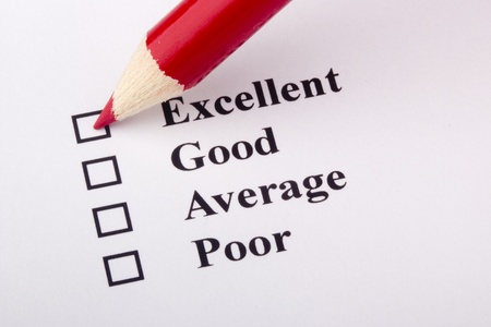 A red pencil laying on a customer service survey.の写真素材