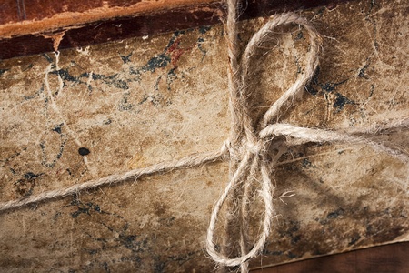 Archival book in a book-depository are tied up by a cord.の写真素材