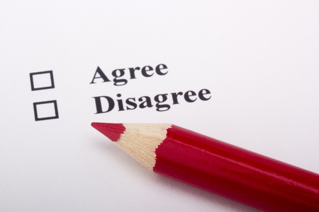 A red pencil laying on an opinion poll.の写真素材