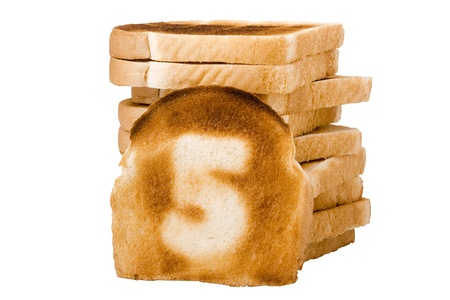 Number 5 burnt on a slice of white bread isolated on a white background.の写真素材