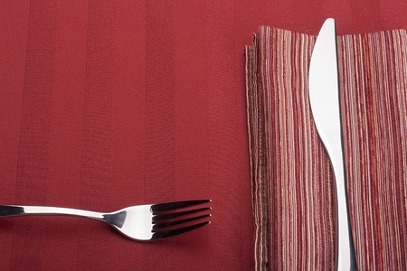 Knife and fork on a napkin as a dining room serving.