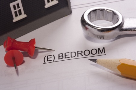 Construction tools laying on a bedroom construction plan.の写真素材