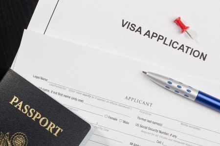 Directly above photograph of an application for a visa.