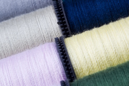 Full frame shot of a variety of spools of thread.