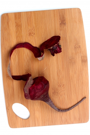Natural red beets on a cutting board.の写真素材