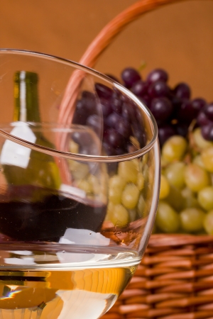 Wine glass with grape wine and grapes for dessert.の写真素材