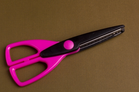 Scissors with dark violet handles for decorative works.の写真素材