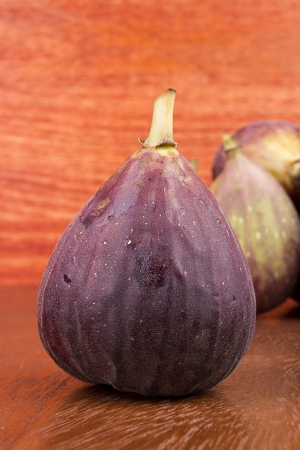 The fruits of fig tree on a wooden surface.の写真素材