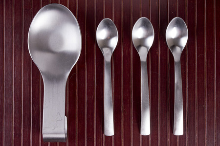 Kitchen utensils - spoon rack soiled spoons and forks.の写真素材