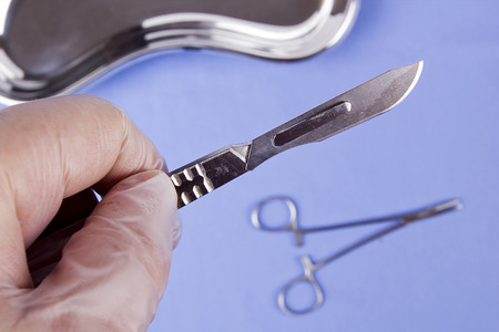 Professional surgical instrument in hand physician. Operating.の写真素材