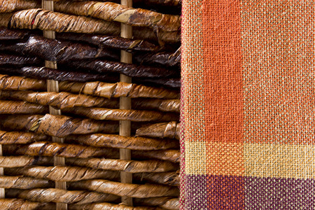 Background with napkin cloth and baskets of twigs.