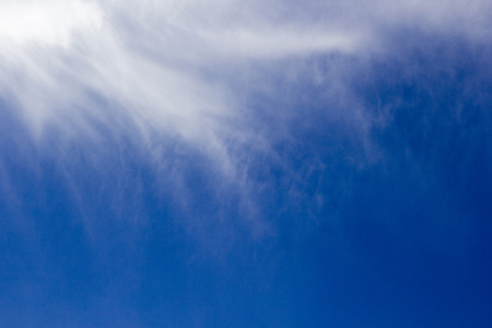 Part of cirrus clouds with a portion of the blue sky.