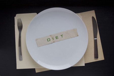 The plate with the message Diet next fork and knife.の写真素材