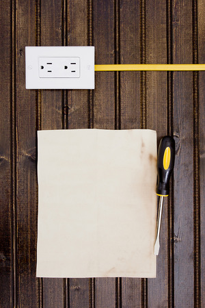 Socket with cable connected to a wooden wall.の写真素材